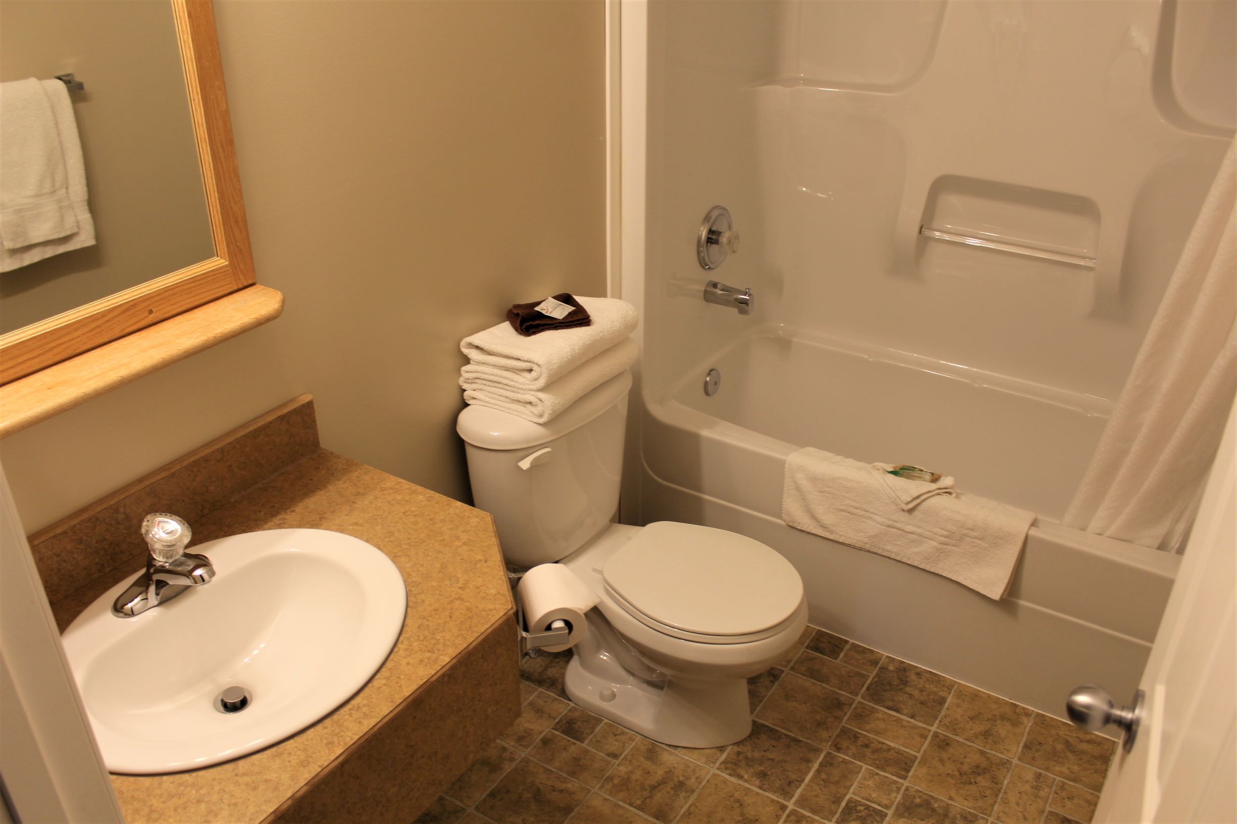 2 BEDROOM SUITE - 2 Bedroom Room with 1 Queen Bed Per Room, with Double Bed In Couch (on LaCreteInn&Suites.ca)
