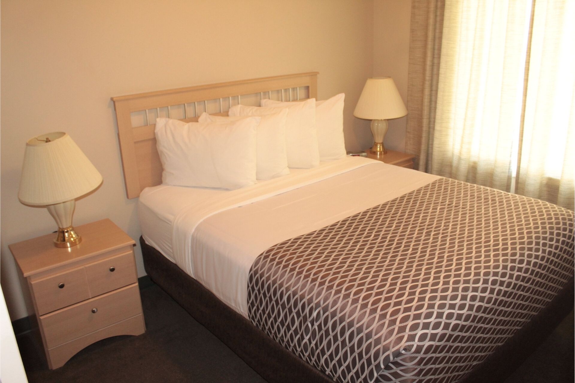 2 BEDROOM SUITE - 2 Bedroom Room with 1 Queen Bed Per Room, with Double Bed In Couch (on LaCreteInn&Suites.ca)